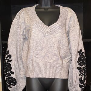 bebe Gray V-Neck Sweater with Black Floral Embroidered Sleeves